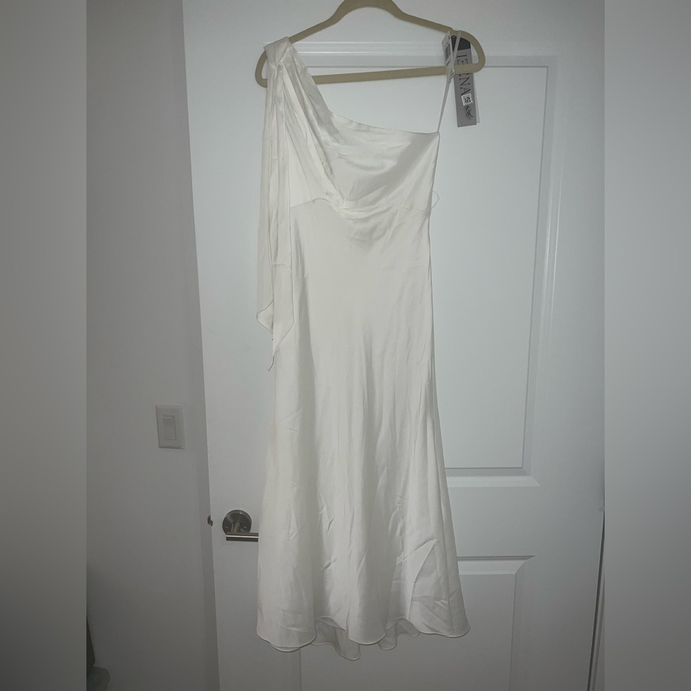 One shoulder white silky dress. Perfect for the bride for the night before.